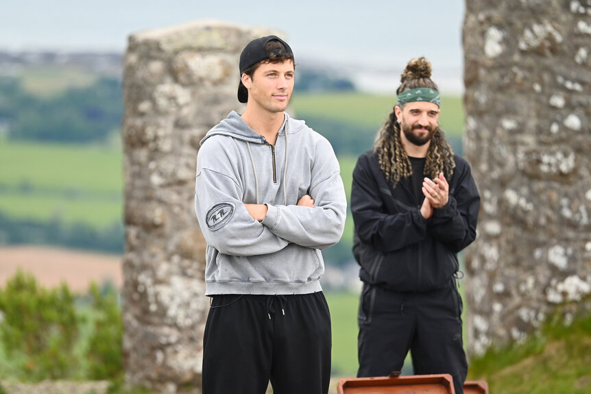 Rob Rausch and Mark Ballas standing outside on The Traitors Season 4 Episode 7.