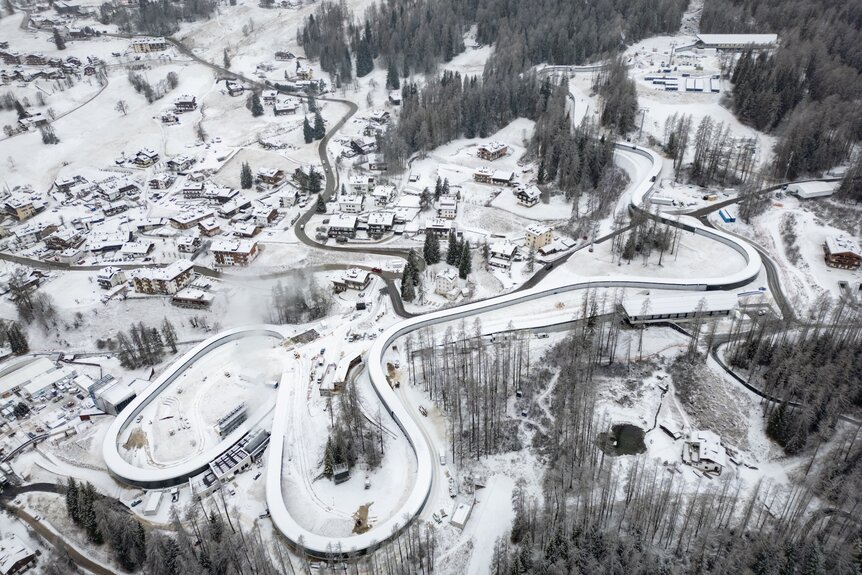 An aerial view of the Olympic sliding center for the Milano Cortina 2026 Winter Olympics.