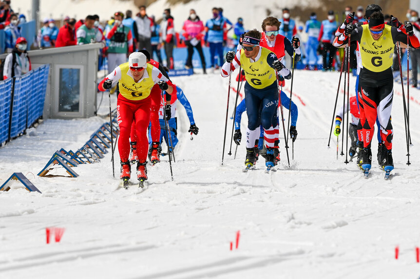 Athletes compete during the Para Cross-Country Skiing during the Beijing 2022 Winter Paralympics.