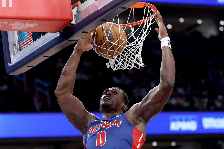 Jalen Duren of the Detroit Pistons dunks the ball against the Washington Wizards .