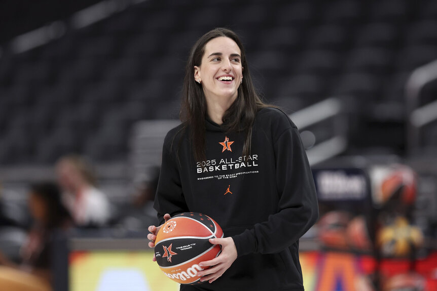 Caitlin Clark , #22 of the Indiana Fever, smiling during a practice session.