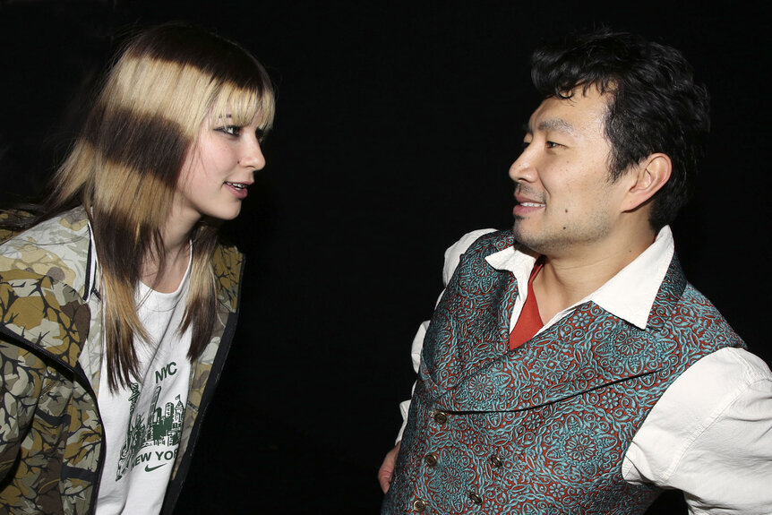 Alysa Liu and Simu Liu talking backstage.