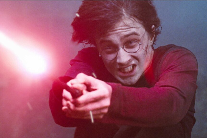 Harry Potter casting a spell with a beam of light in Harry Potter and the Goblet of Fire (2005).