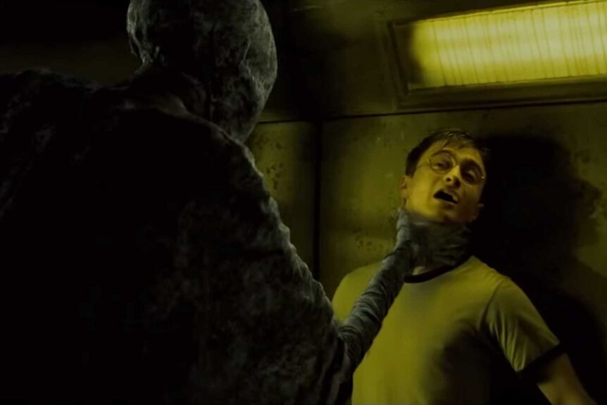 Harry Potter being strangled by a death eater in Harry Potter and the Order of the Phoenix (2007).