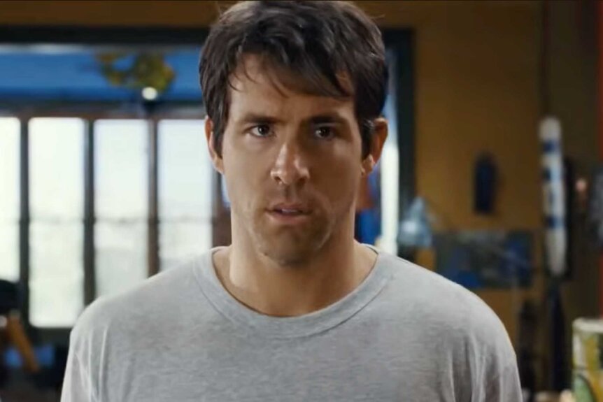 Mitch standing in a white t-shirt in The Change-Up (2011).