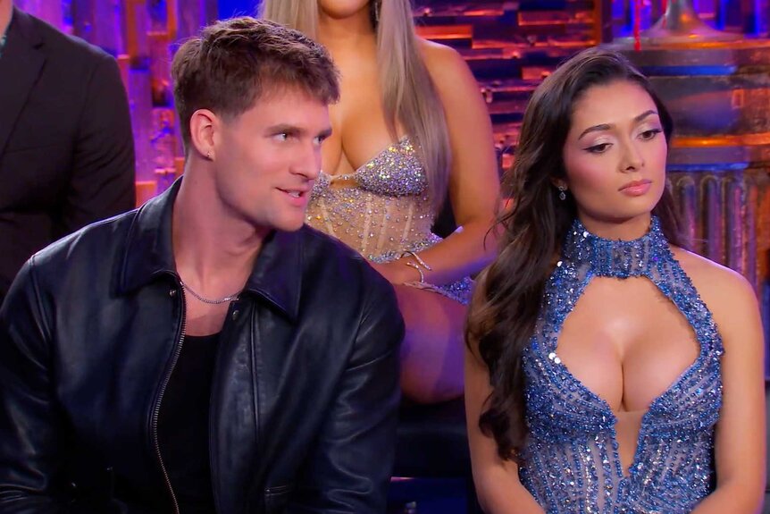 Shayne Davis and Angelica Jensen sitting together during the Vanderpump Rules Season 12 Reunion.