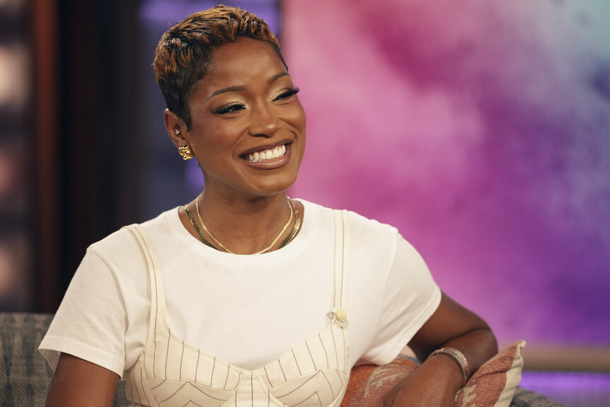 Keke Palmer sitting and smiling in The Kelly Clarkson Show Season 7 Episode 75.