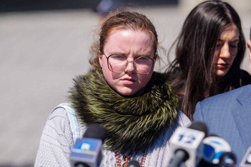 Victoria Heuermann, the daughter of Rex Heuermann, speaks to the media at Suffolk County Court.