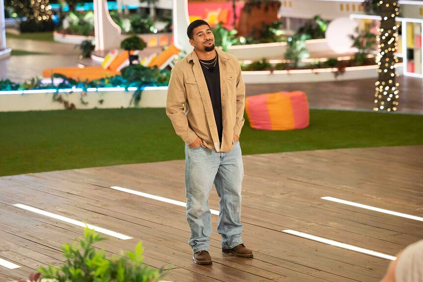Sean David Reifel standing with his hands in his pockets on Love Island USA Season 8.