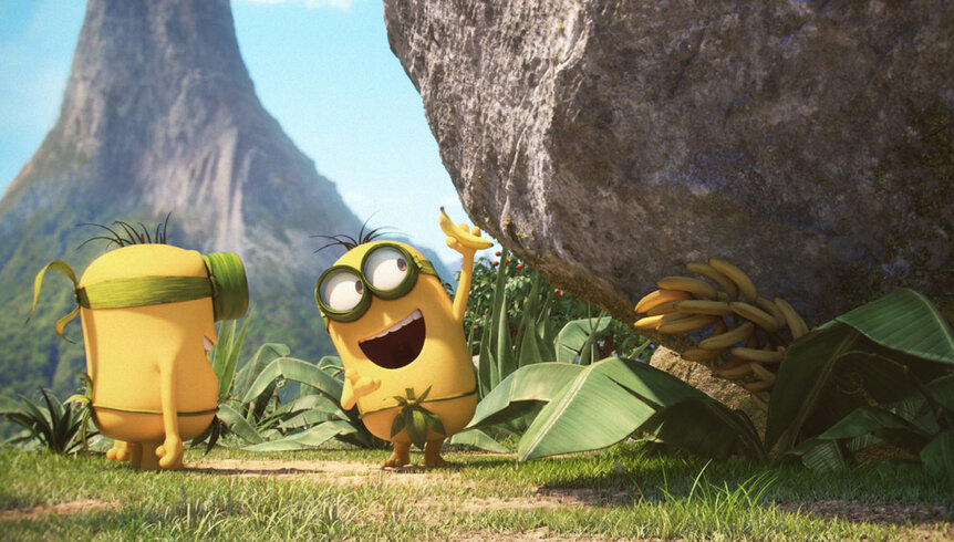 The Minions standing by a rock in Minions (2015).