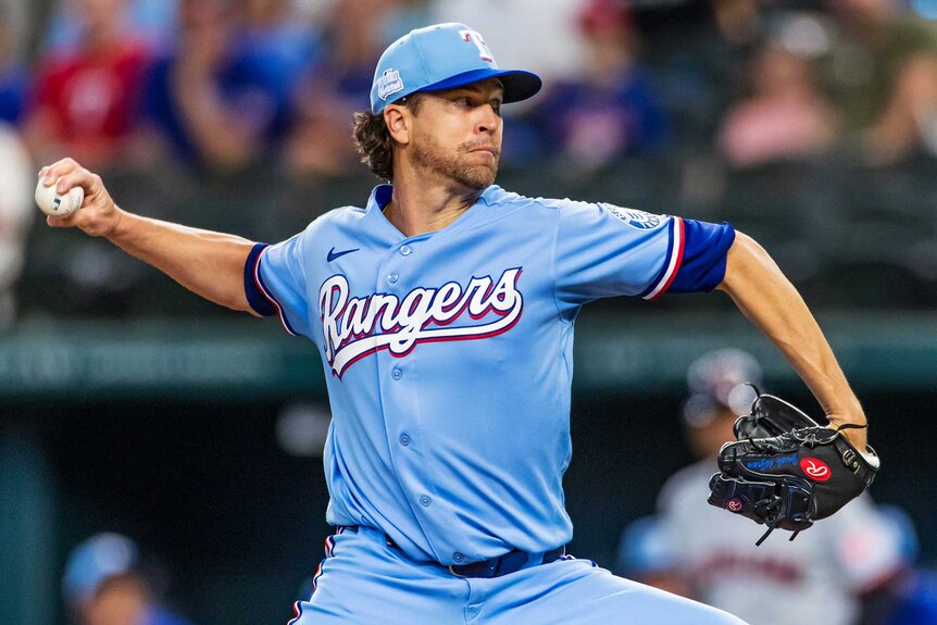 Jacob deGrom of the Texas Rangers pitches during the first inning of a game against the Cleveland Guardians.