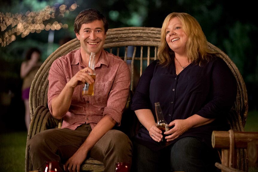 Bobby and Tammy drinking while sitting together in Tammy (2014).
