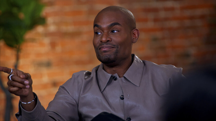 Paul C. Brunson pointing and smiling in Married at First Sight Season 20 Episode 9.