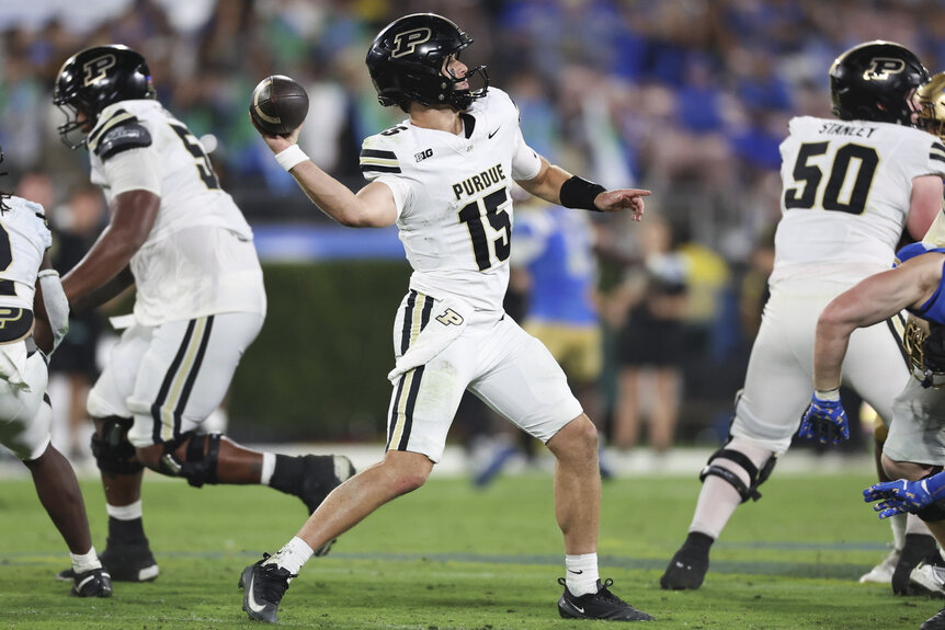 Ryan Browne, #15 of the Purdue Boilermakers, throwing the football during a game.